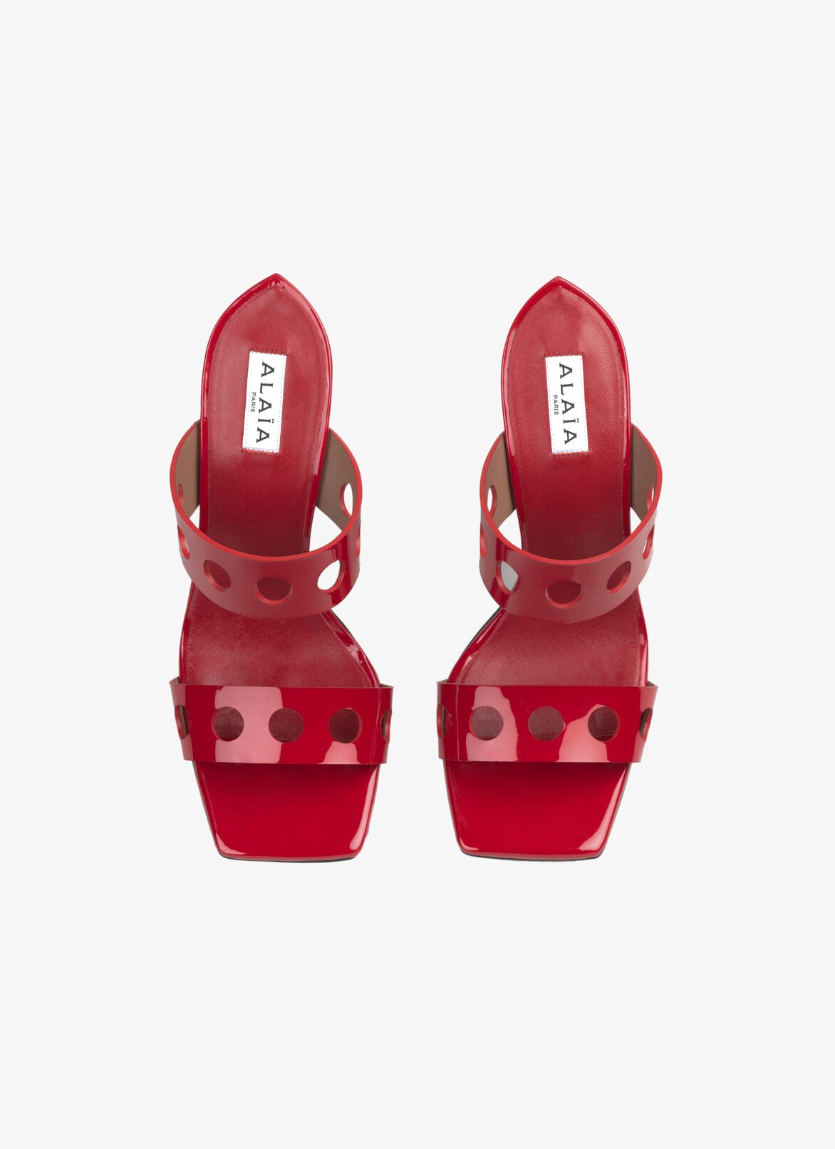 Perforated sandals in patent calfskin ALAÏA LACQUER RED PERFORATED SANDALS IN PATENT CALFSKIN